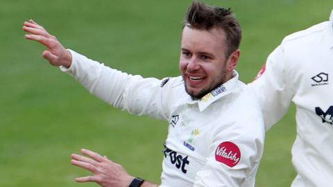 Mason Crane celebrates taking a wicket