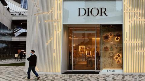 Pedestrians walk past DIOR store in Shanghai, China, 23 February 2023.