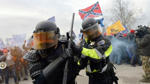 Trump supporters clash with police and security forces as they try to storm the US Capitol