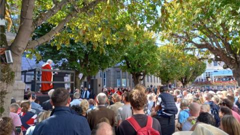 Islanders outside the royal court in Jersey paying respects to Her Late Majesty Queen II