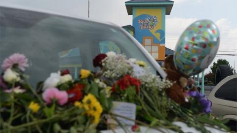 Cards and flowers left at the scene of a boat sinking near Branson, Missouri, which left 17 people dead, 20 July 2018