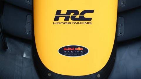 Honda Racing and Red Bull Racing logos on a car