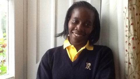 Joyce Aruga wearing a Rossholme school uniform