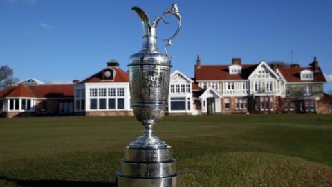 The Claret Jug trophy beside the 18th green in front of the clubhouse during The Open Championship media day at Muirfield on April 29, 2013