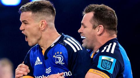 Johnny Sexton celebrates with Cian Healy after scoring one of Leinster's eight tries at the RDS