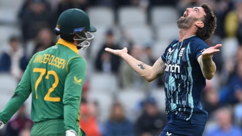 England bowler Reece Topley celebrates the wicket of South Africa's Rassie van der Dussen in the second ODI at Emirates Old Trafford