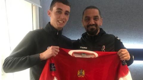 Ben Grice and Scott Murray holding a Bristol City football shirt between them