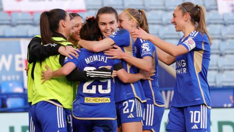 Leicester City players celebrate a goal