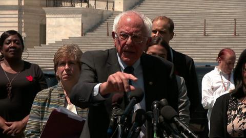 Bernie Sanders speaks at podium