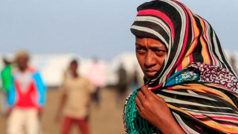 An Ethiopian refugee, who fled the Tigray conflict, walks in the Tenedba camp in Mafaza, eastern Sudan - January 2021