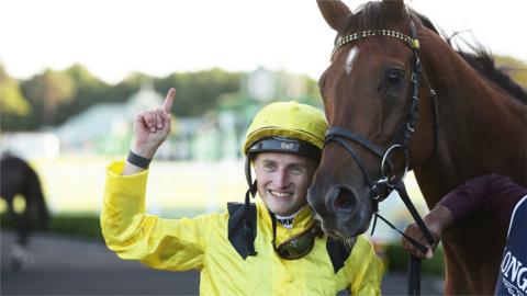 Jockey Tom Marquand celebrating with horse Addeybb after winning the Queen Elizabeth Stakes at Randwick in Australia