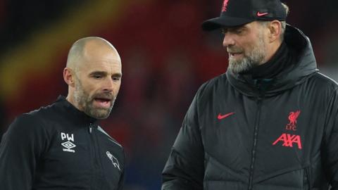 Derby boss Paul Warne (left) with Liverpool manager Jurgen Klopp