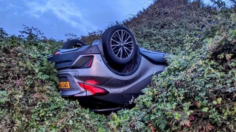 The car which fell over the cliff at Bracelet Bay.