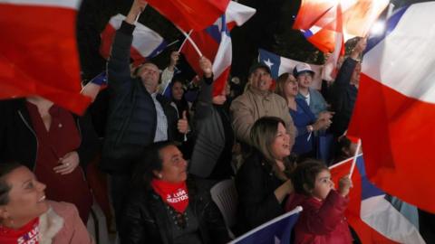 A group of people gather at the election watch party of the Republican Party, awaiting the results of the elections for Constitutional Councillors, in Santiago, Chile, 07 May 2023
