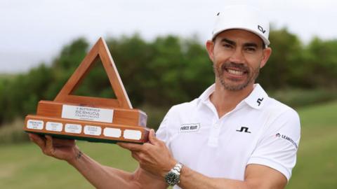 Camilo Villegas holds the Butterfield Bermuda Championship trophy
