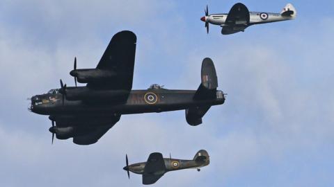 A Hurricane, Spitfire and Lancaster Bomber from the Battle of Britain Memorial Flight in the air at the air show