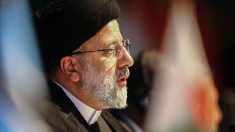 Ebrahim Raisi attends a meeting during the 2023 BRICS Summit at the Sandton Convention Centre in Johannesburg on August 24, 2023