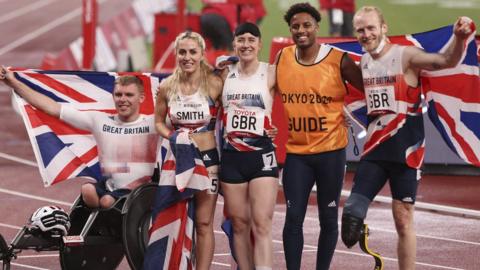 Universal relay medallists Nathan Maguire, Ali Smith, Libby Clegg, guide Chris Clarke and Jonnie Peacock celebrate their medal