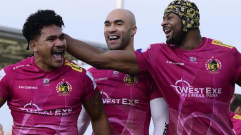 Exeter celebrate a try against Bulls