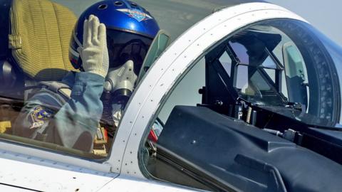 A Russian pilot salutes from the cockpit of a jet, at last year's International Military-Technical Forum, at Kubinka training ground, Moscow