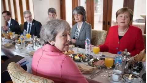 Theresa May and Angela Merkel at EU-Arab League summit