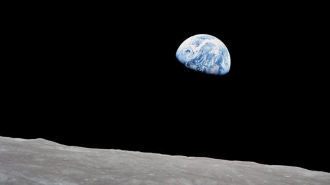 The earth behind the moon