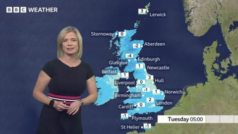 Sarah Keith-Lucas stands in front of a weather map of the UK