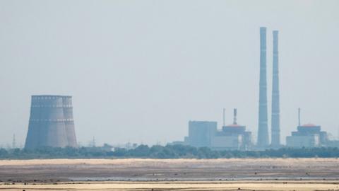 A view shows Zaporizhzhia Nuclear Power Plant from the bank of Kakhovka Reservoir near the town of Nikopol in June 2023