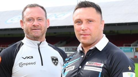 Dragons commercial director Jonathan Westwood and Gerwyn Price at Rodney Parade