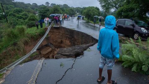 A general view of a collapsed road caused by flooding waters due to heavy rains following cyclone Freddy in Blantyre