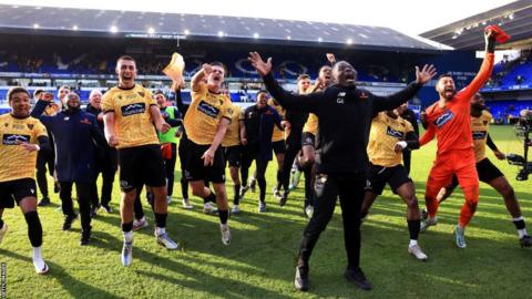 Maidstone United celebrate at Portman Road after beating Ipswich Town.