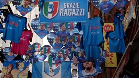 Banners and shirts in an expectant Naples
