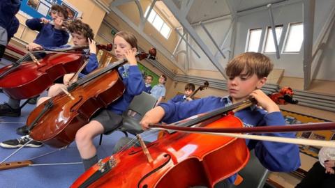 Children of Eyke primary playing in orchestra