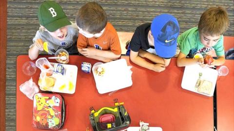 Kids eating school lunch