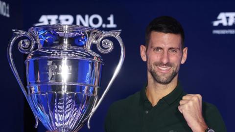 Novak Djokovic holds the ATP world number one trophy