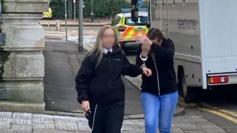 Rebecca Press and a court officer arriving at Cardiff Court
