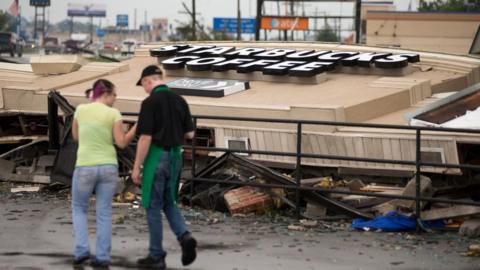 A Starbucks is demolished after an apparent tornado touched down in Kokomo