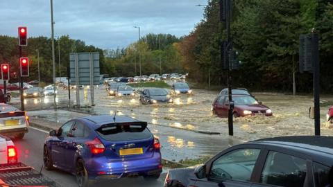 Cars in flooded road