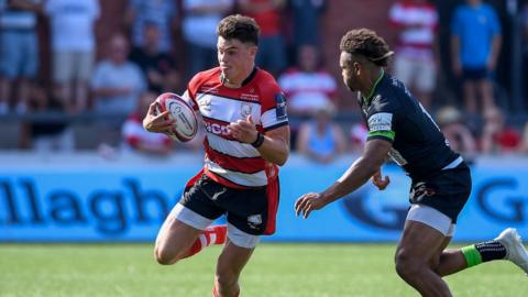 Gloucester centre Louis Hillman Cooper takes on a Nottingham player with the ball in hand during their Premiership Rugby Cup match