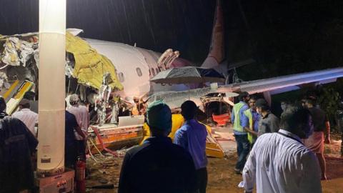 Indian Civil Defense handout photo shoes the wreckage of Flight IX 1134 at Calicut airport (7 August 2020)