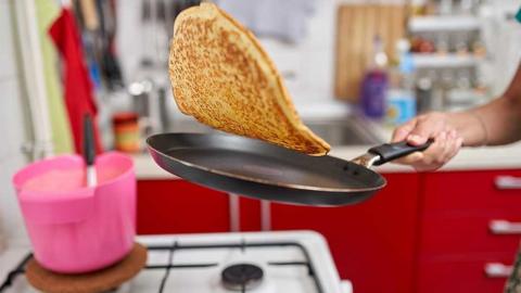 Pancake cooking in frying pan