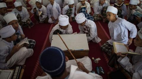 Malaysian religious students read the Koran at school during the Muslim holy fasting month of Ramadan in Hulu Langat, near Kuala Lumpur on 30 June 2014.