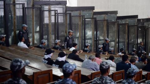 This picture shows the courtroom and soundproof glass dock (bottom) during the trial of Egyptian photojournalist Mahmoud Abu Zeid