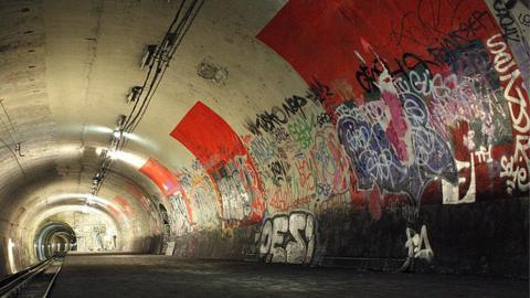 An abandoned metro station in Paris covered in graffiti