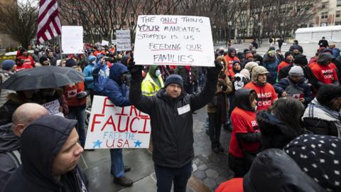 People gather for a protest against COVID-19 vaccination mandates in the Brooklyn borough of New York, New York, USA, 07 February 2022