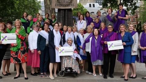 Female MPs pictured next to the statue of suffragist Millicent Fawcett