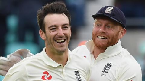 Toby Roland-Jones celebrates with Jonny Bairstow