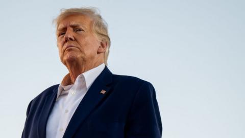 Former U.S. President Donald Trump looks on during a rally at the Waco Regional Airport on March 25, 2023 in Waco, Texas. Former U.S. president Donald Trump attended and spoke at his first rally since announcing his 2024 presidential campaign.