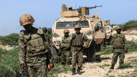 Ugandan soldiers of African Union's peacekeeping mission in Somalia (AMISOM) search for explosive devices next to their base in Ceeljaale, southern coastal Somalia, on September 19, 2019.