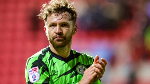 Matty Taylor applauds the fans for Forest Green Rovers